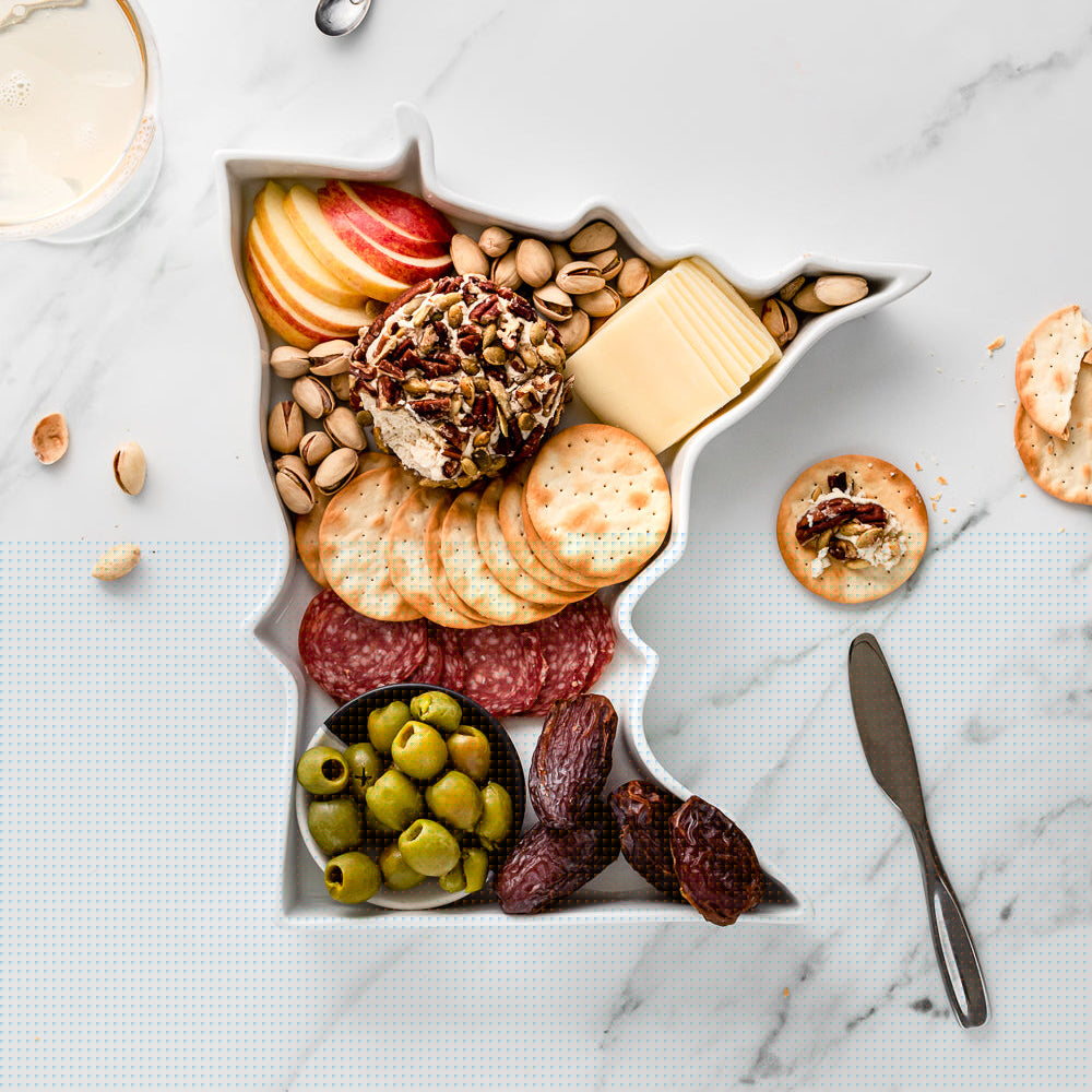 charcuterie board with cheese and cured meats in a Minnesota shaped serving tray platter dish
