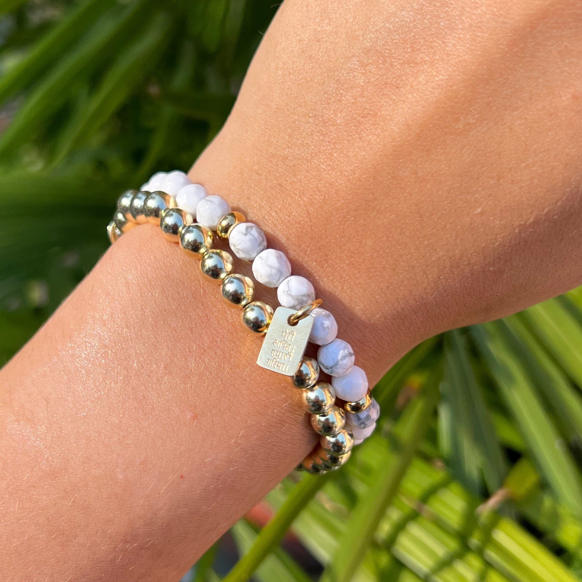 howlite and gold beaded bracelet stack